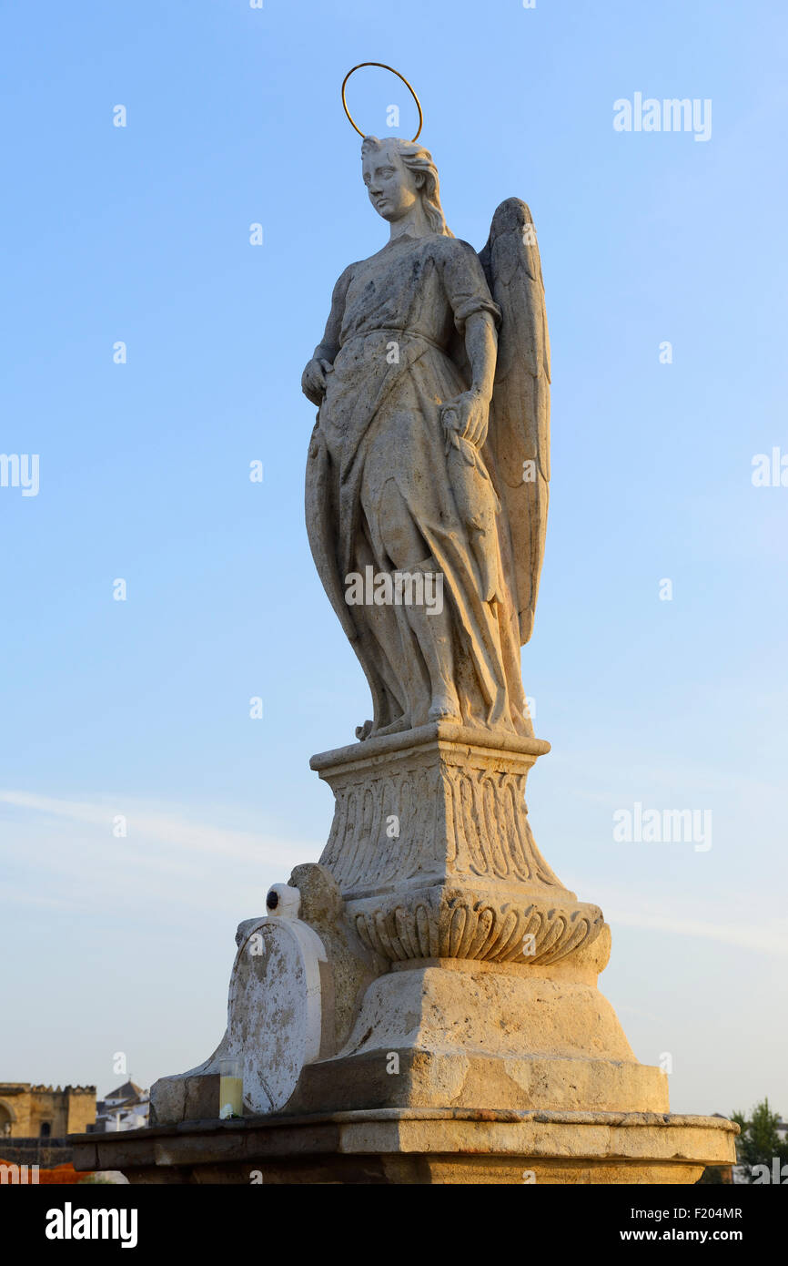 Statue Of San Rafael on Roman Bridge (Puente Romano) over Guadalquivir River in Cordoba, Andalusia, Spain Stock Photo