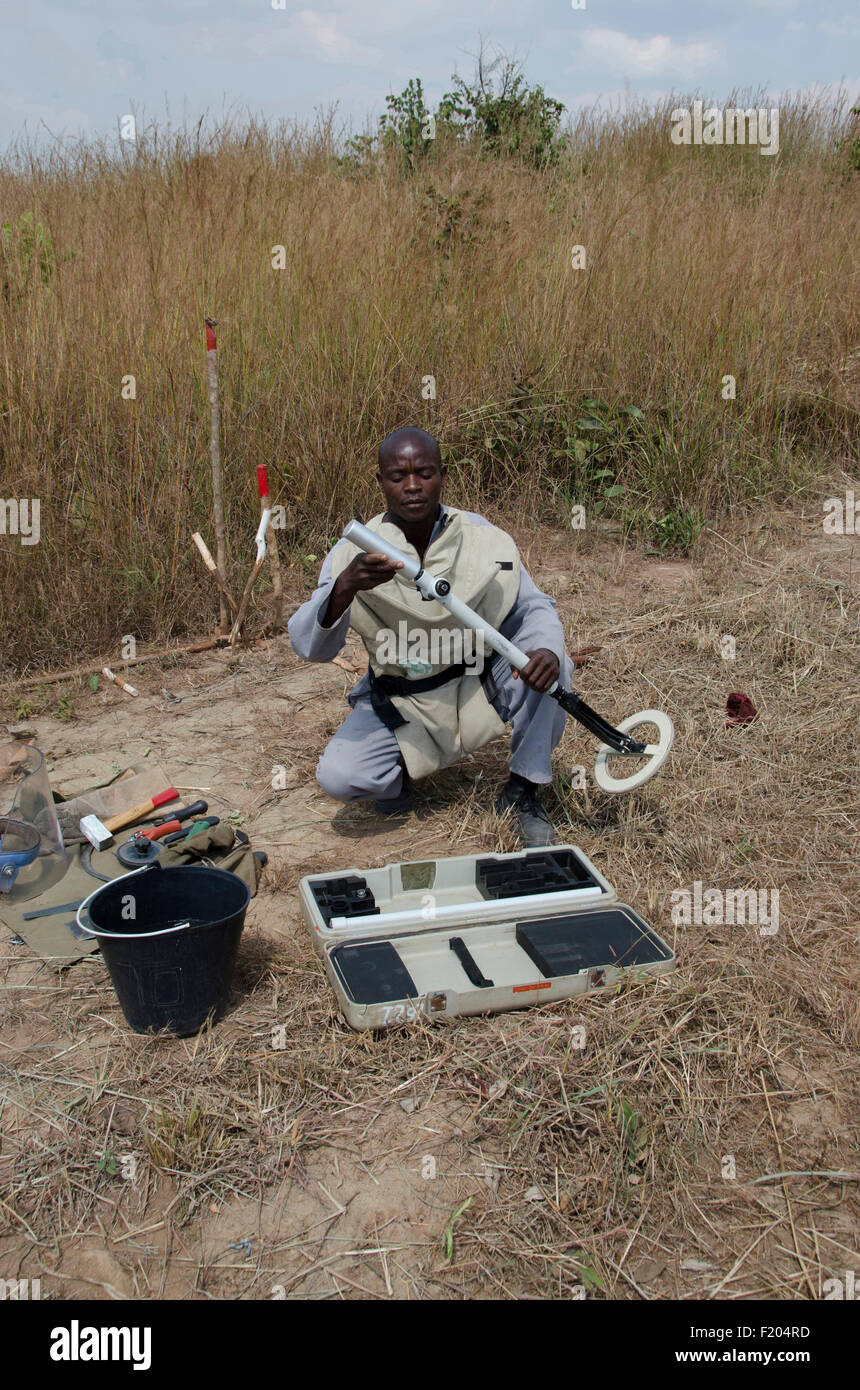 Angola, Mine clearence specialist preparing equipment used to look for unexploded ordenance. Stock Photo