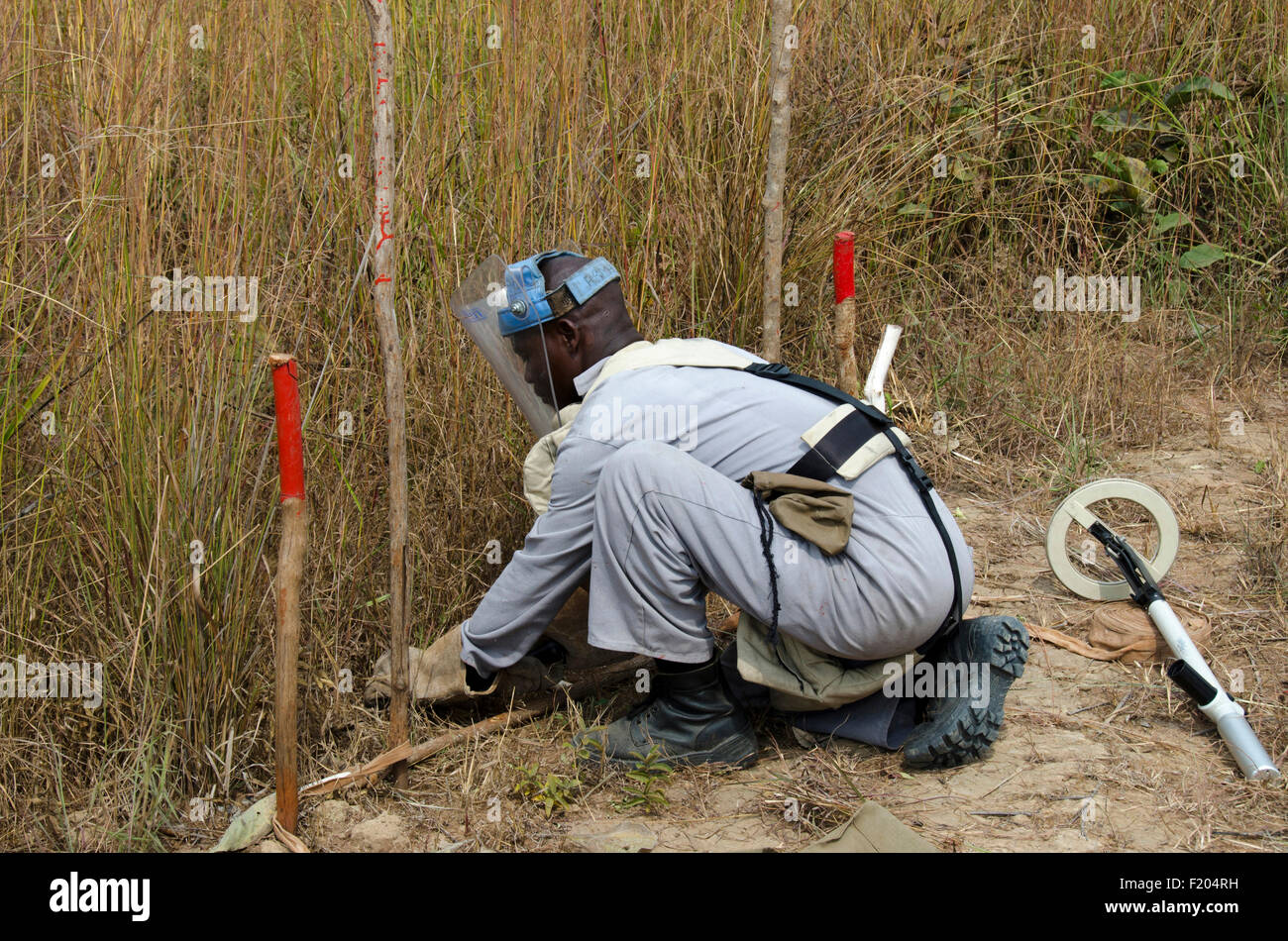 Angola, Mine clearence specialist preparing equipment used to look for unexploded ordenance. Stock Photo