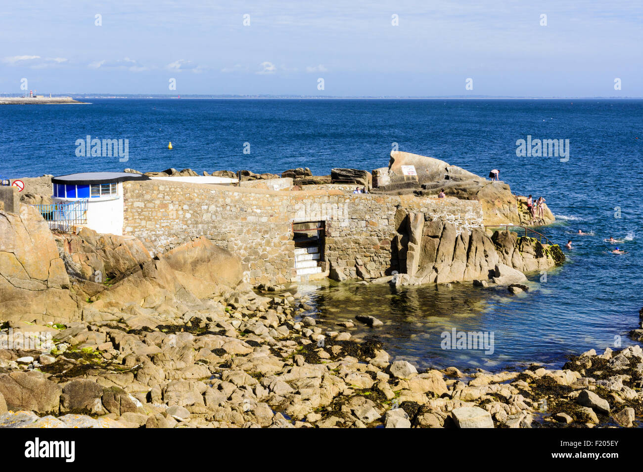 People swimming at Forty Foot bathing place, Sandycove, Dun Laoghaire–Rathdown, Ireland Stock Photo