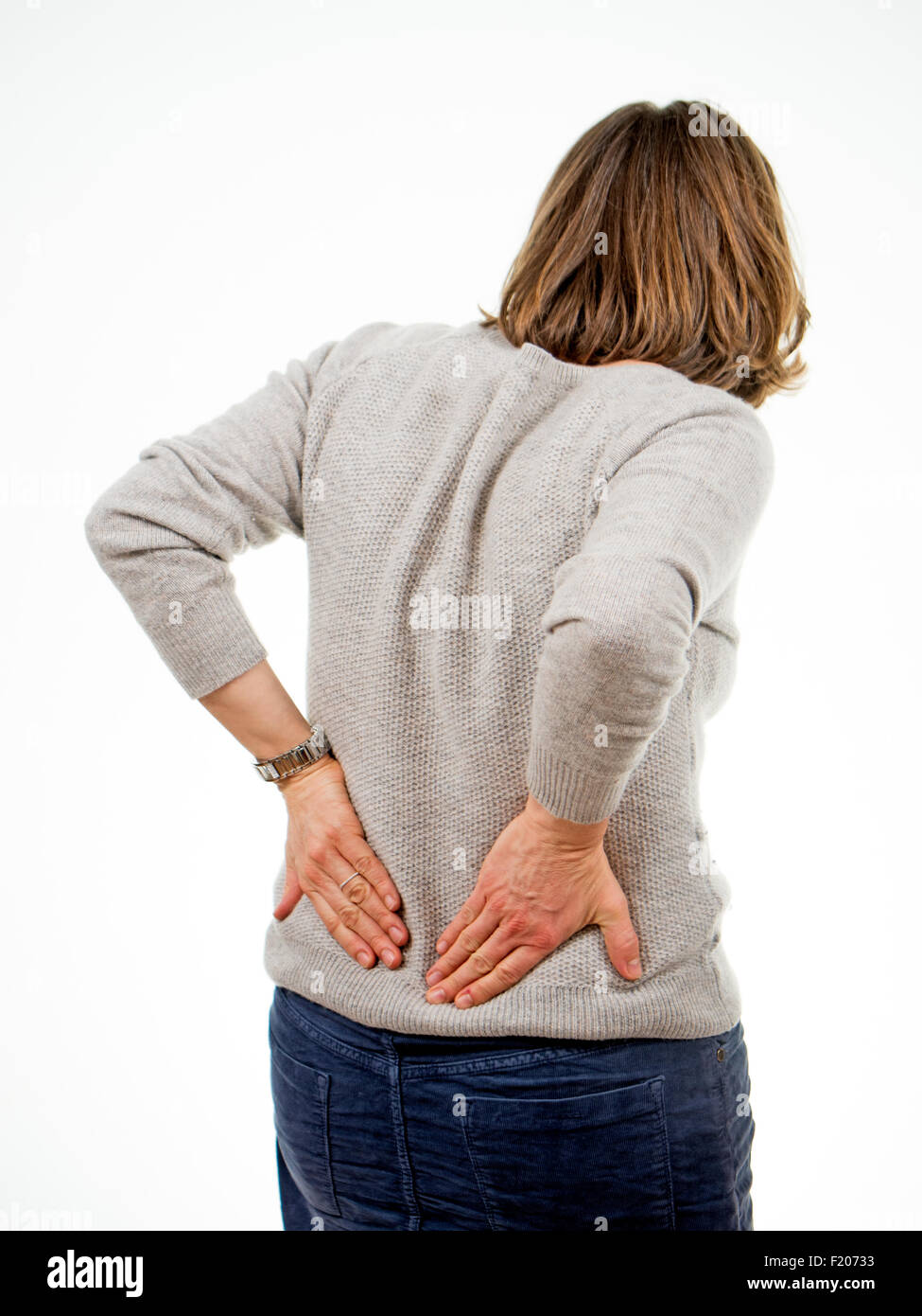 Frau hat Rückenschmerzen Stock Photo
