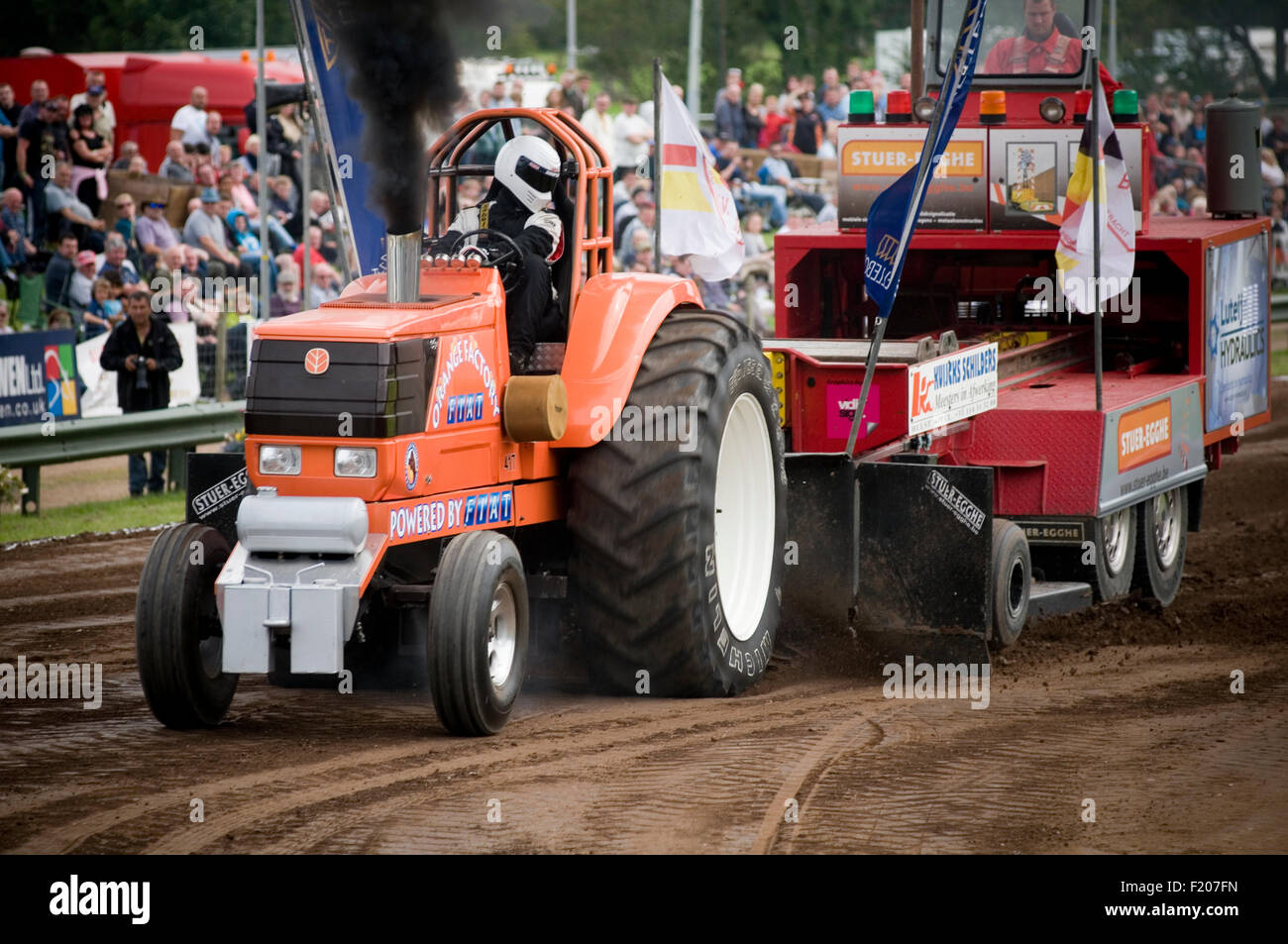 tractor pull pulling puller pullers diesel smoke thick black smokey particulate particles Stock Photo