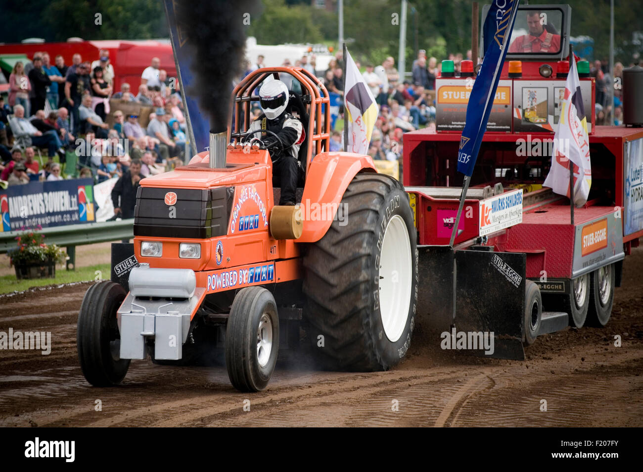 tractor pull pulling puller pullers diesel smoke thick black smokey particulate particles Stock Photo