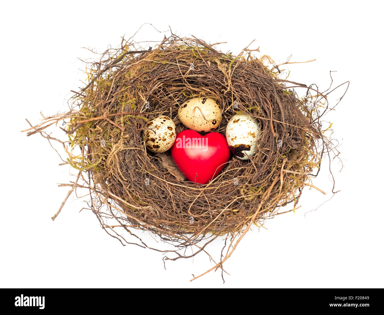 Nest mit 3 Eiern und einem Herz Stock Photo