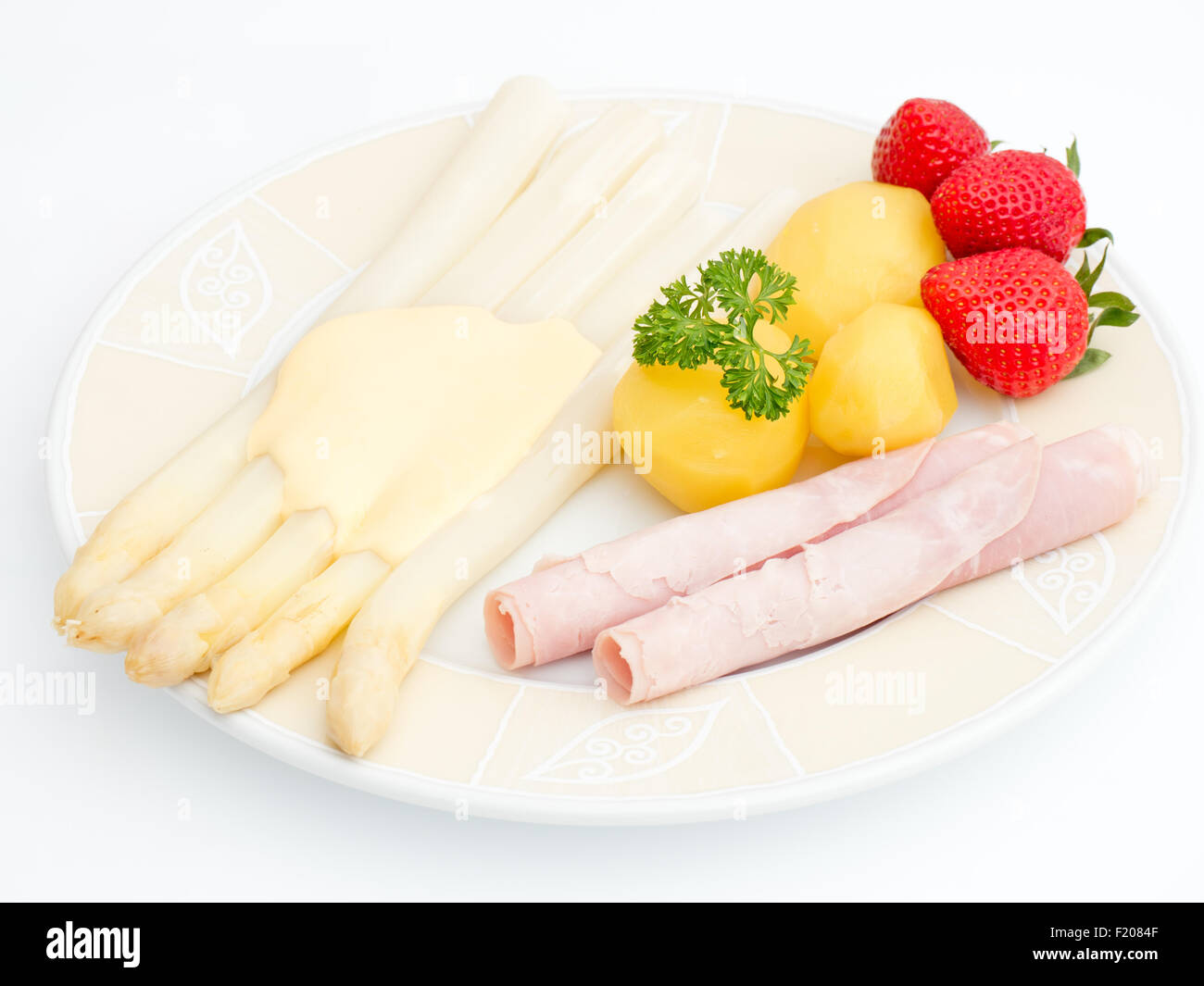 Kartoffeln mit Spargel und Schinken Stock Photo