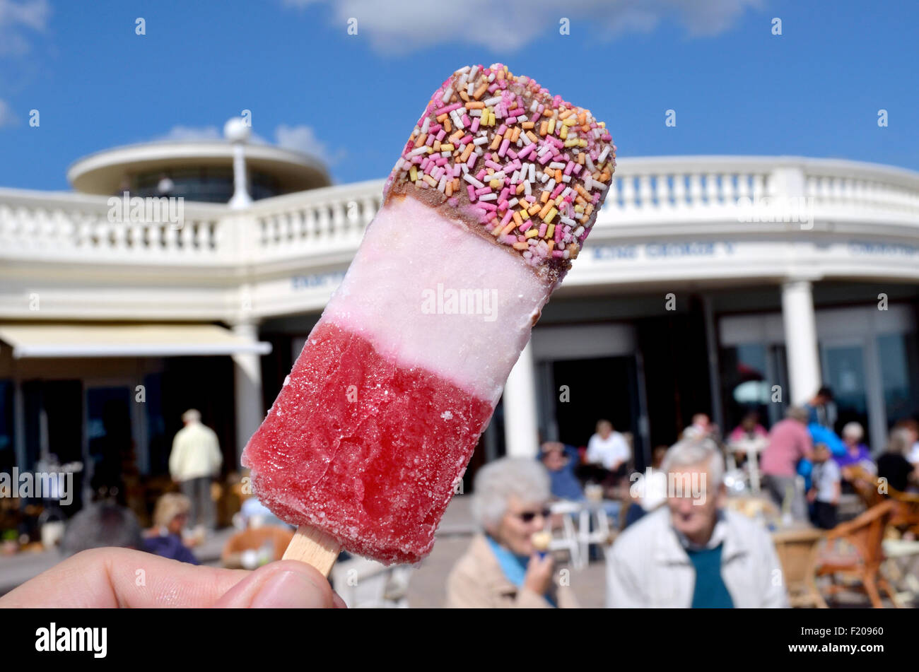 Strawberry Fab ice lolly at the seaside. Bexhill-on-Sea, East Sussex, England, UK. Stock Photo