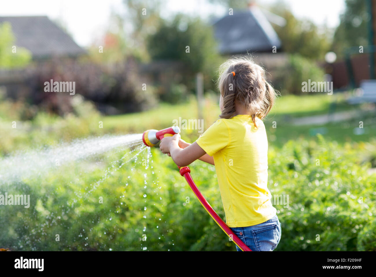 Child working in the garden Stock Photo