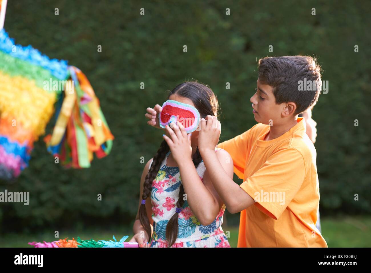 Playing with pinata hi-res stock photography and images - Alamy