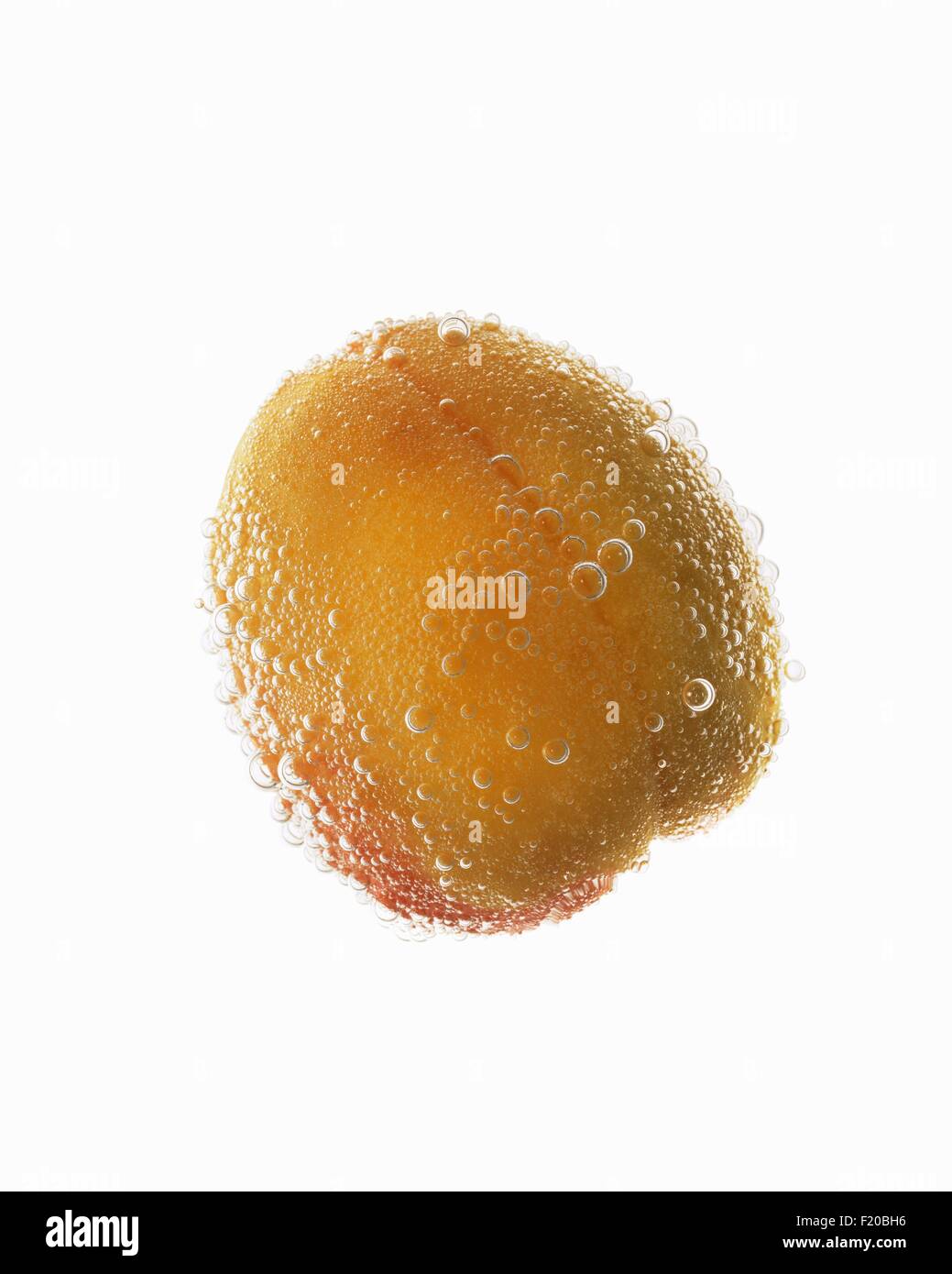 Still life of apricot covered in effervescent bubbles Stock Photo Alamy