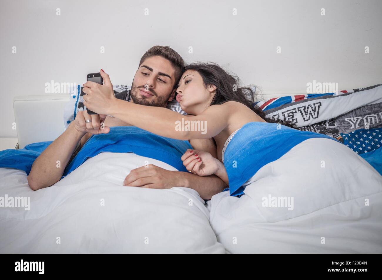 Couple posing for selfie in restaurant Stock Photo - Alamy