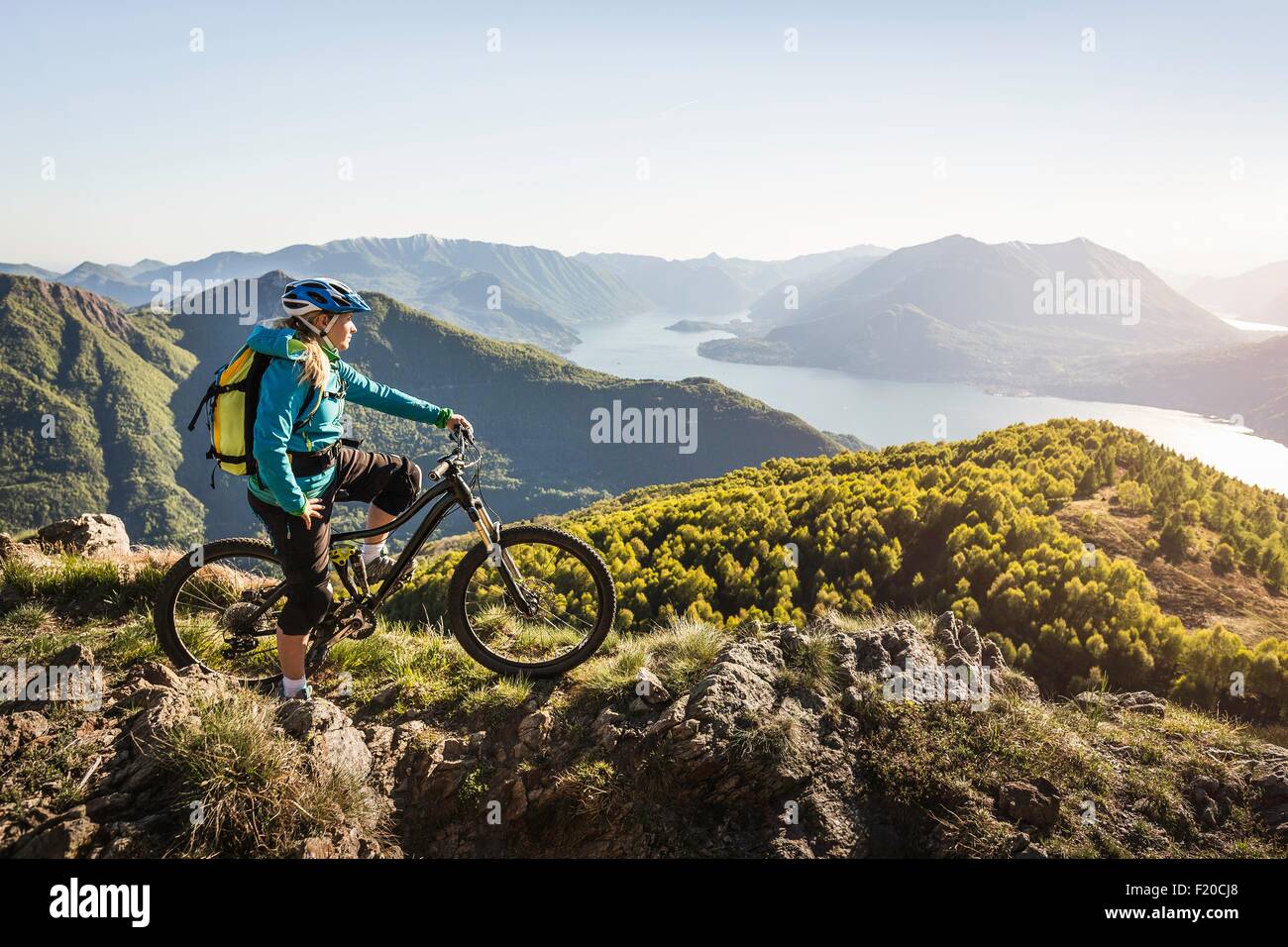 Young woman on mountain bike, looking at view, Lake Como, Italy Stock Photo  - Alamy