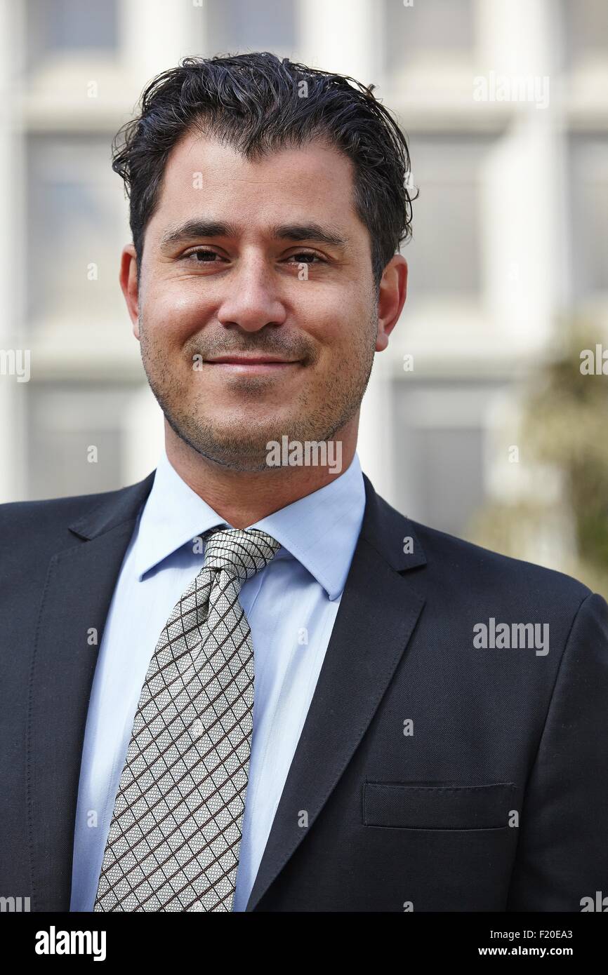 Portrait of mid adult business man, looking at camera, smiling Stock Photo