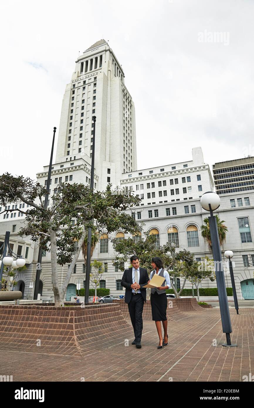 Business people walking across tiled floor, Los Angeles City Hall, California, USA Stock Photo