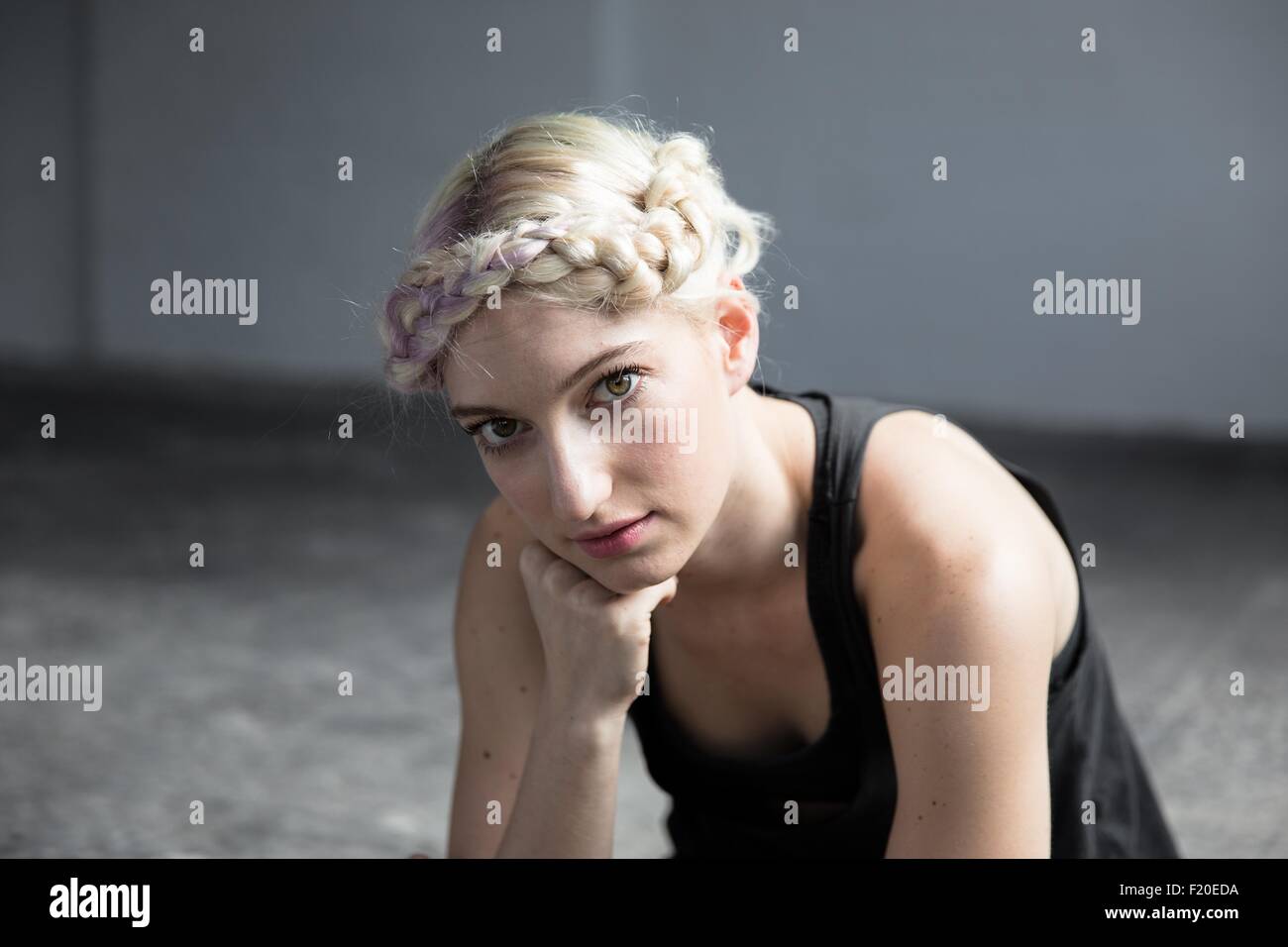 Portrait of young woman with braided hair Stock Photo