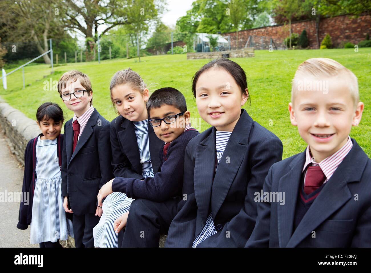 Group of young classmates in playground Stock Photo