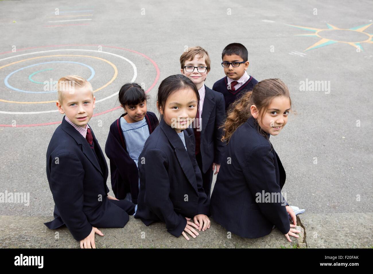 Group of young classmates in playground Stock Photo