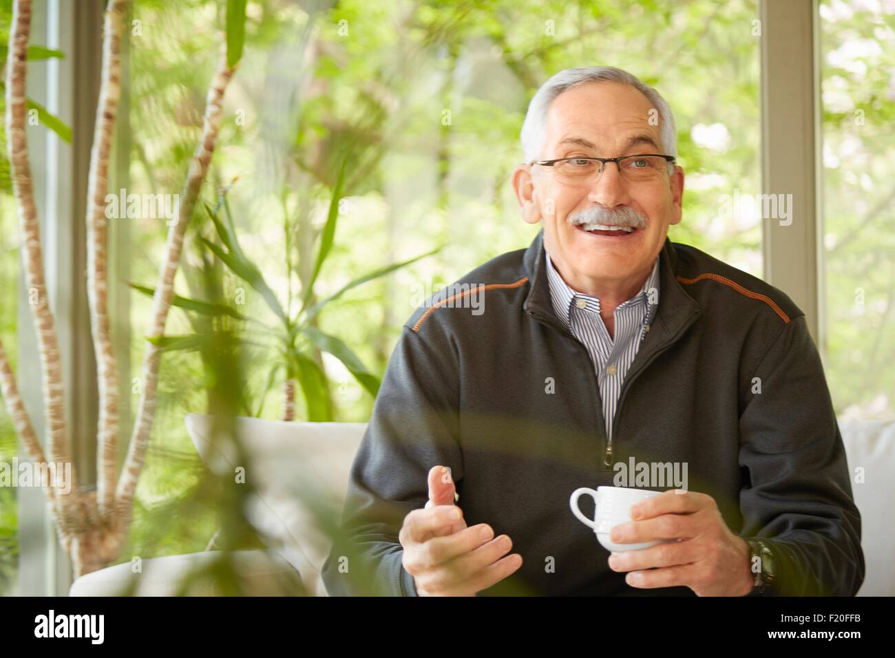 Senior man at home, drinking coffee Stock Photo