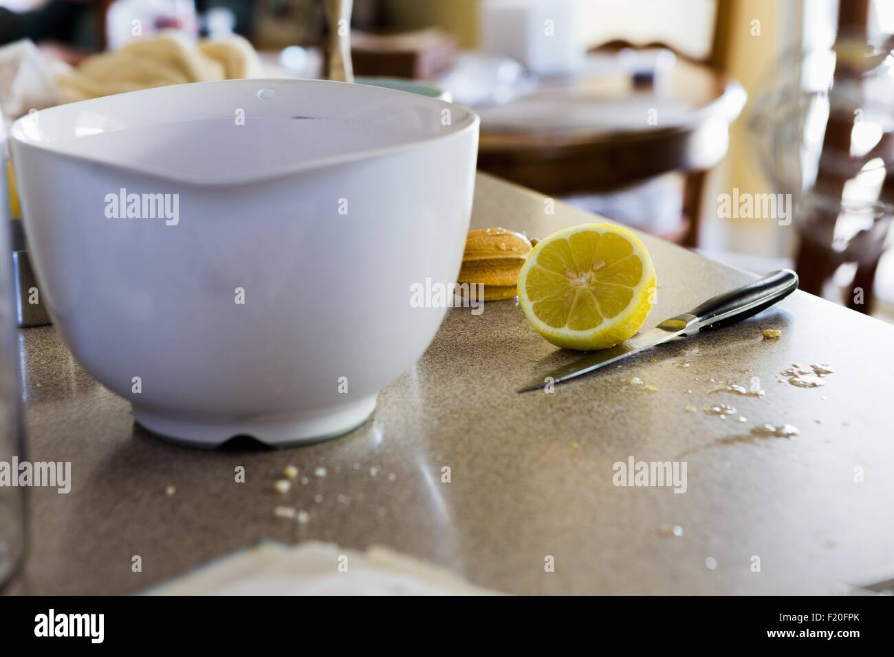 Mixing bowl and halved lemon Stock Photo
