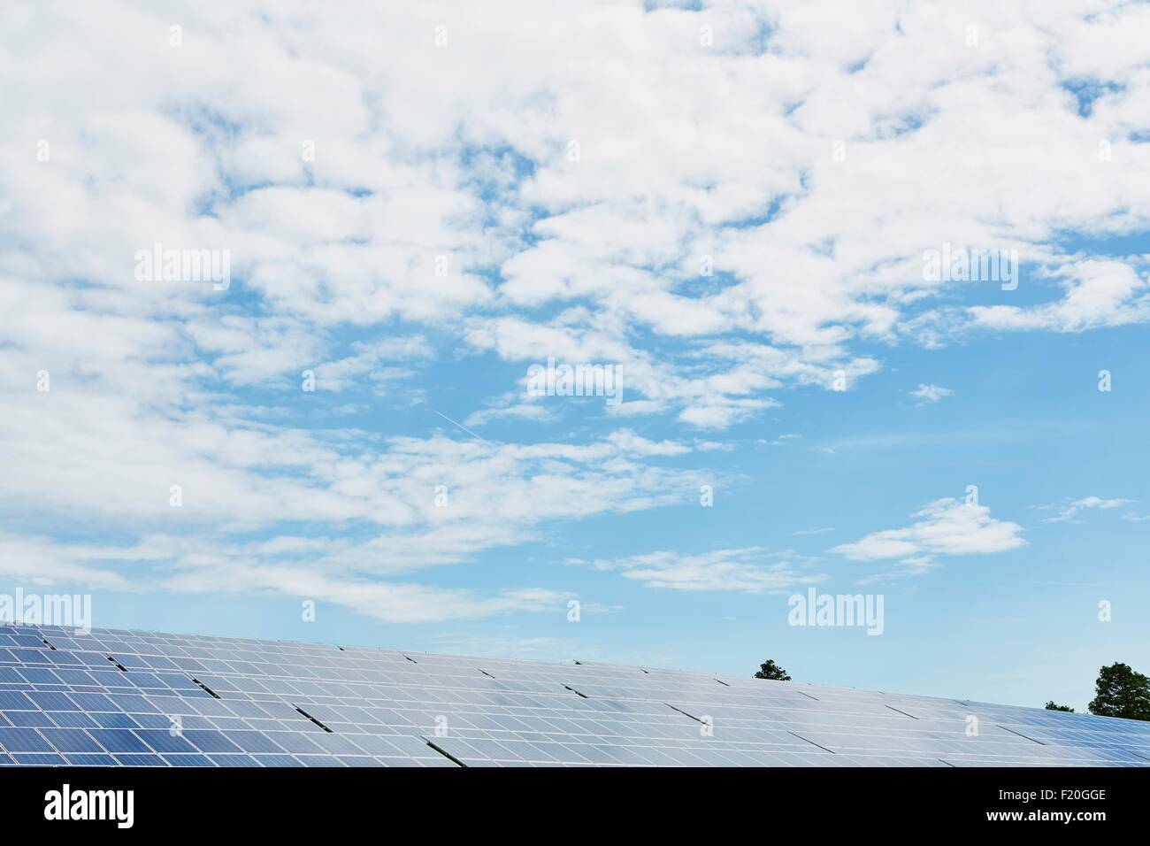 Solar panels against blue sky and clouds Stock Photo