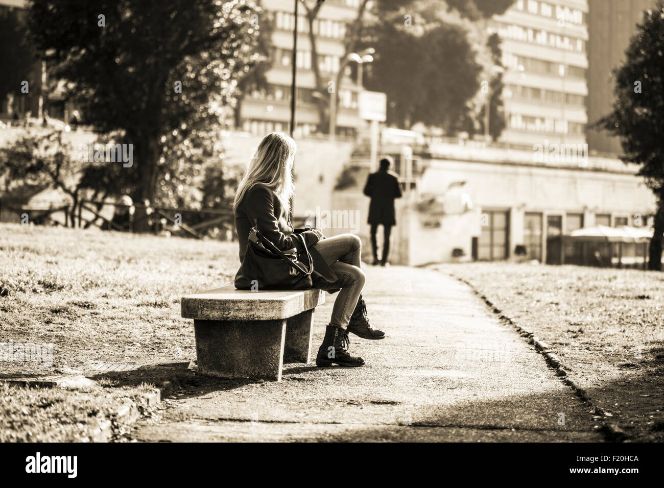Girl sitting on bench hi-res stock photography and images - Alamy