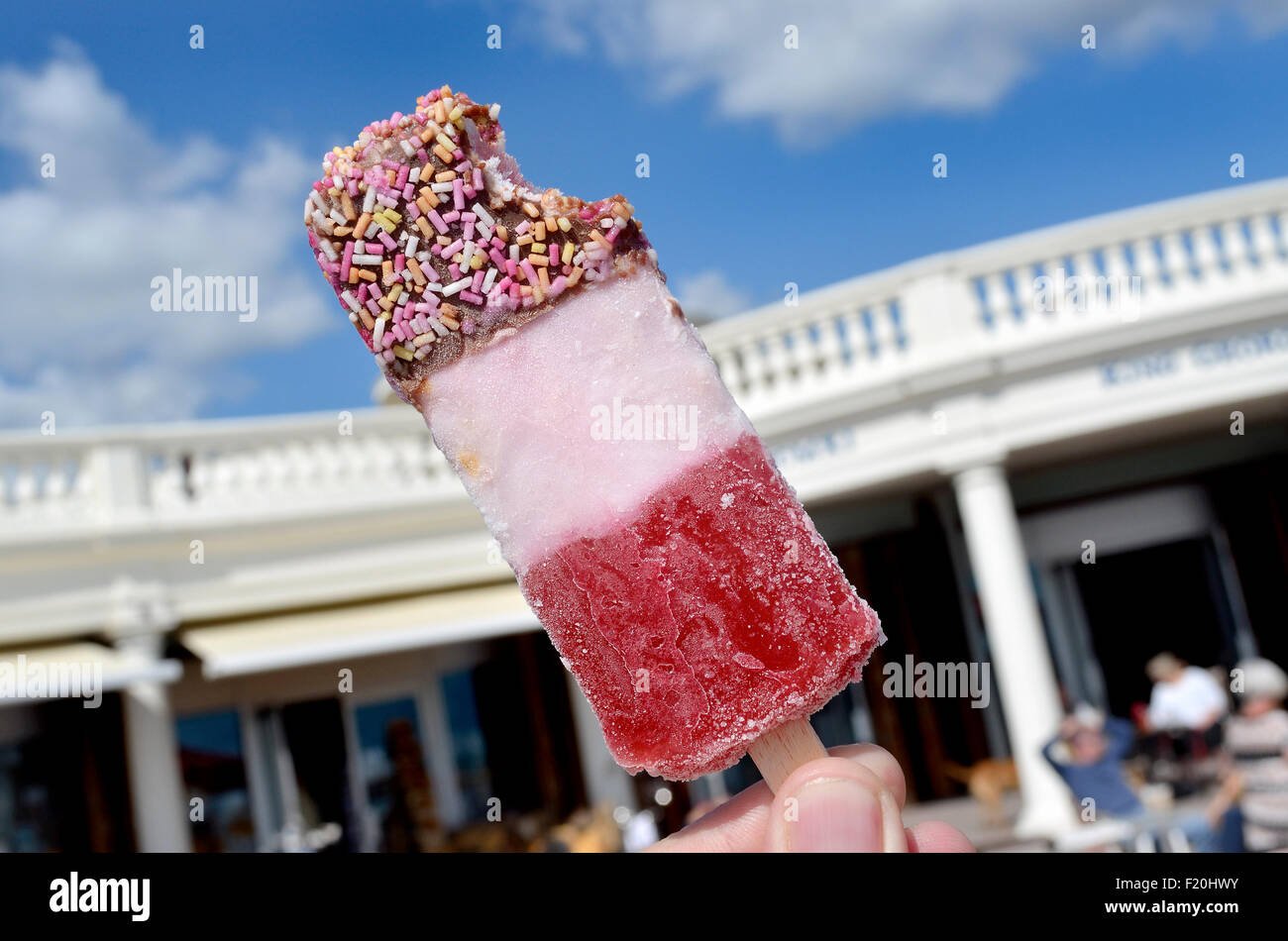 Strawberry Fab ice lolly at the seaside. BexhillonSea, East Sussex