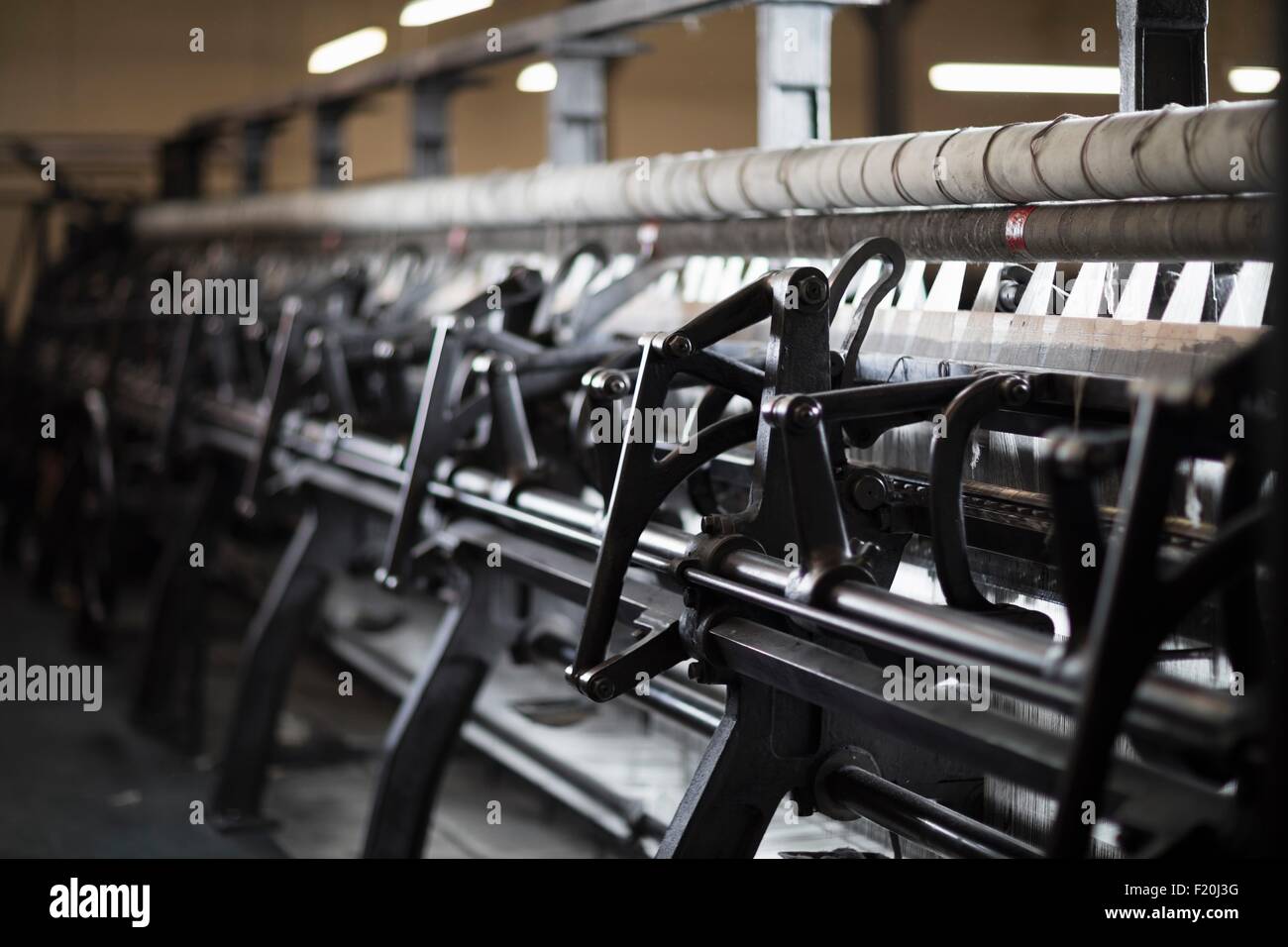 Old weaving machine in textile mill Stock Photo