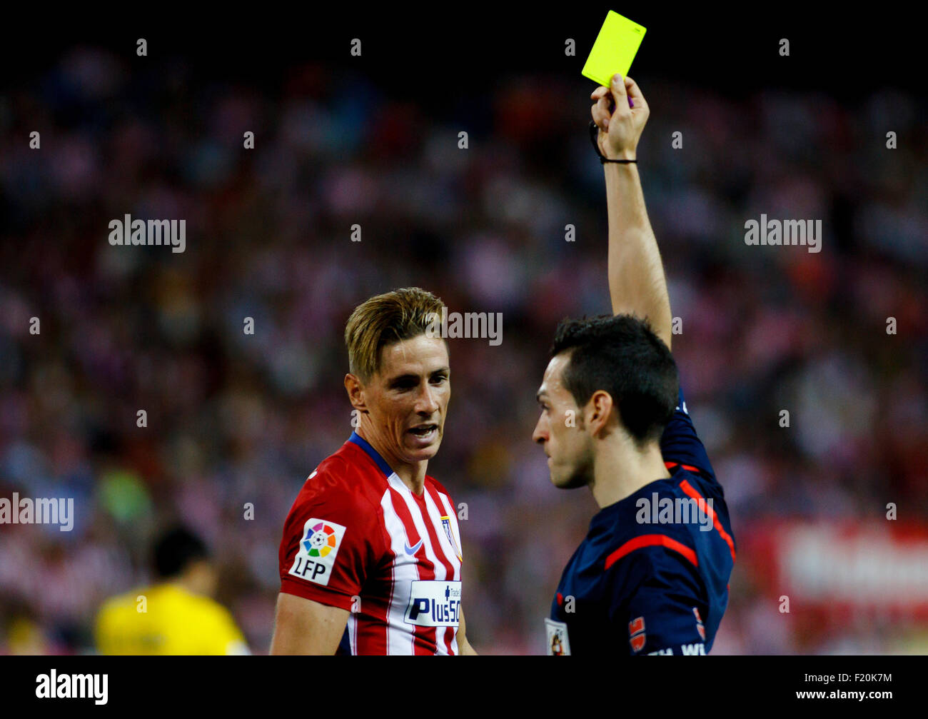 SPAIN, Madrid:Atletico de Madrid's Spanish forward Fernando Torres receives a yellow card during the Spanish League Stock Photo