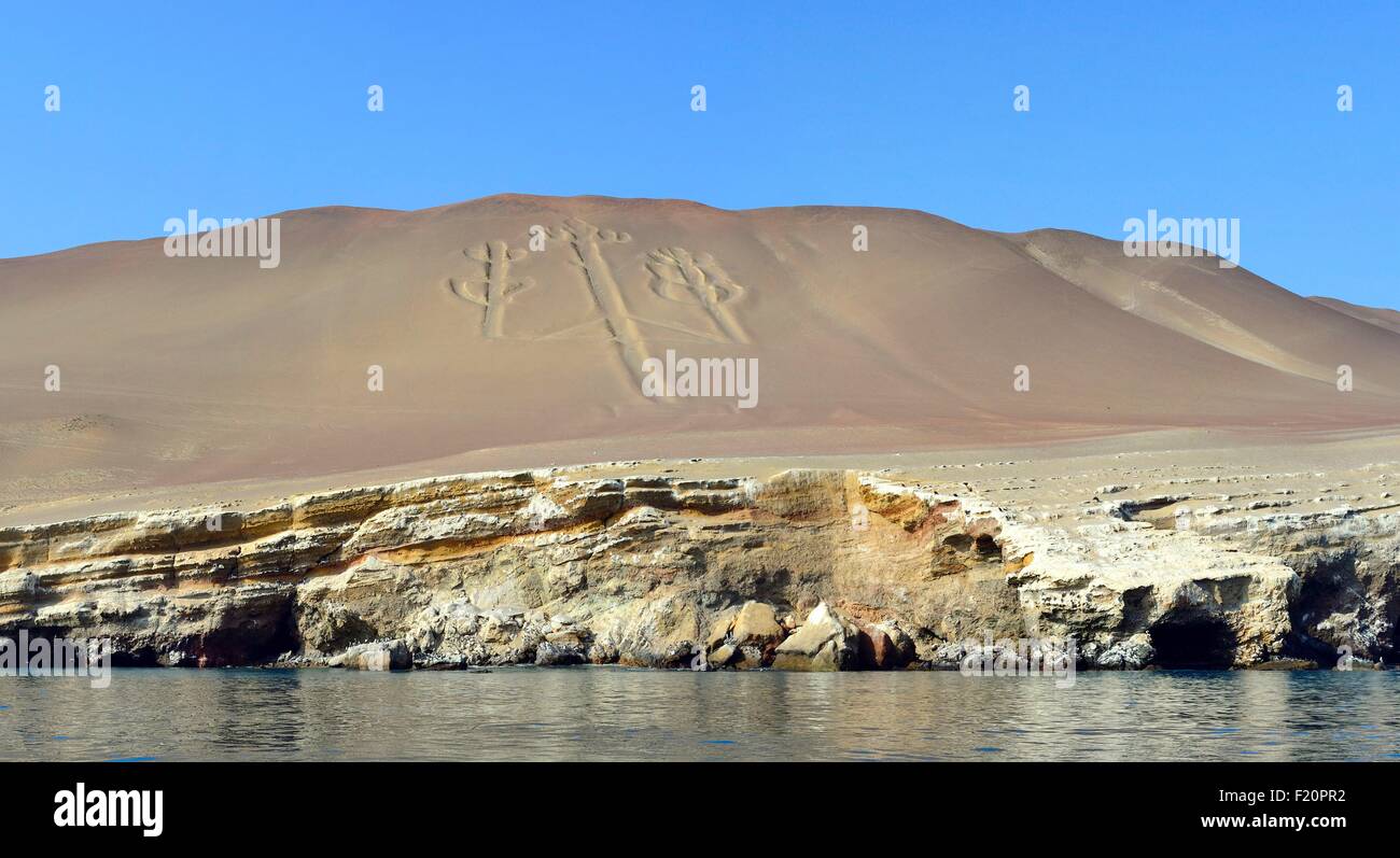 Peru, Pisco Province, Ballestas islands, boat trip across the Paracas National Reserve, the Paracas Candelabra (El Candelabro) is a geoglyph engraved on flank desert Stock Photo