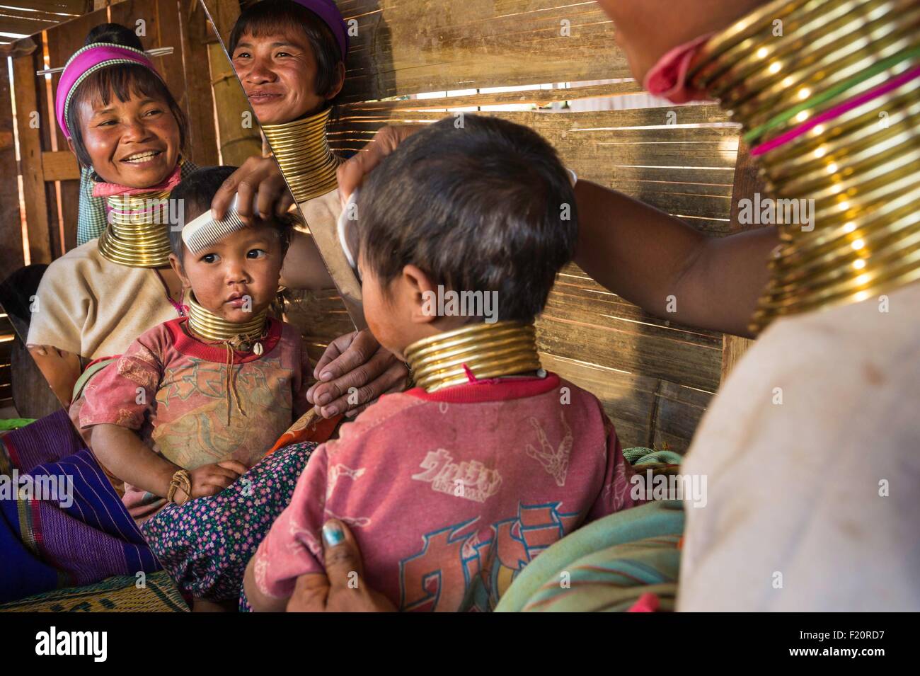 Myanmar (Burma), Kayah state, Kayan tribe (Padaung), Dau Ki (Pan Pat group), Moe Hope and Moe Da getting ready for dancing Stock Photo
