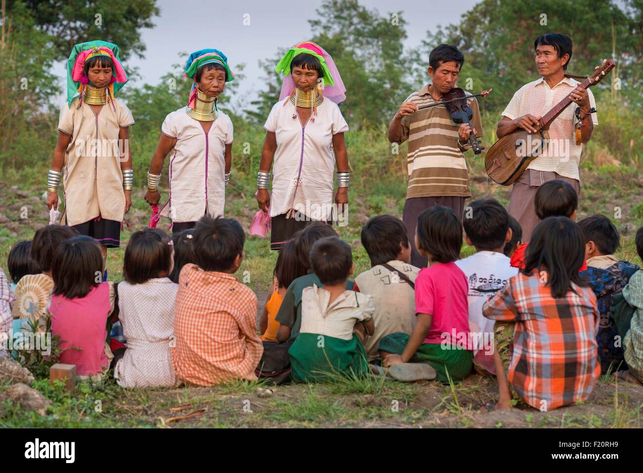 Myanmar (Burma), Kayah state, Kayan tribe (Padaung), Loikaw area, Kon Ta, group of women named giraffe women for the opening ceremony of a rice paddy Stock Photo