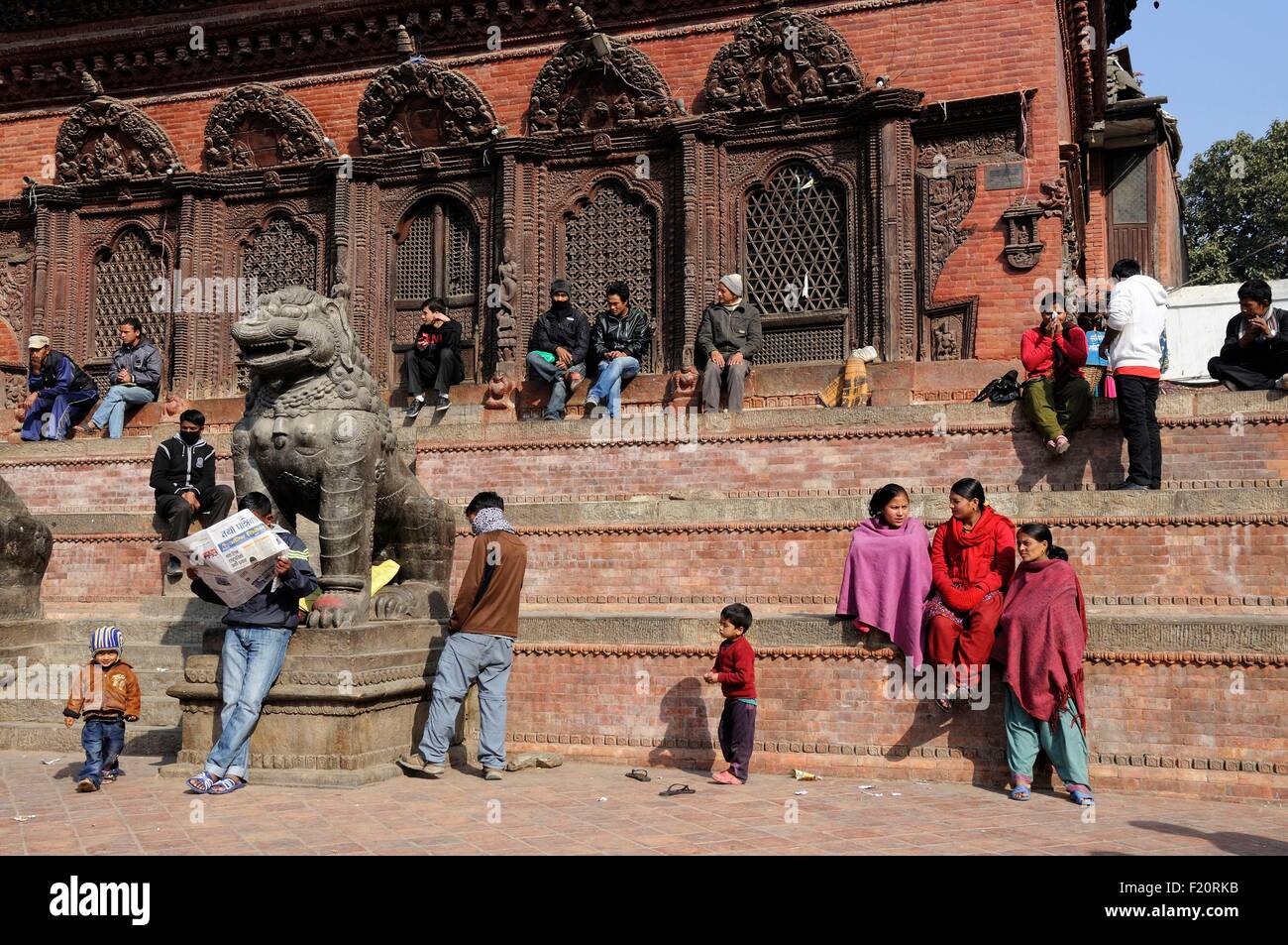 Nepal, Kathmandu valley, Kathmandu, Durbar Square listed as World Heritage by UNESCO, people seated in the morning winter sun at Durbar Square (archives) Stock Photo