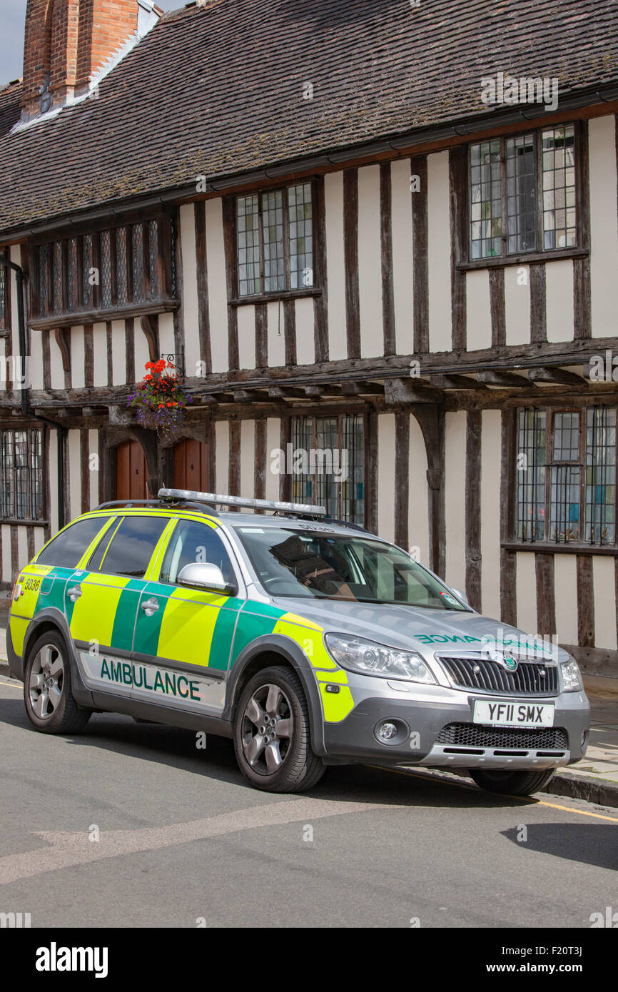 Paramedic vehicle parked outside a timber-framed building, England, UK Stock Photo