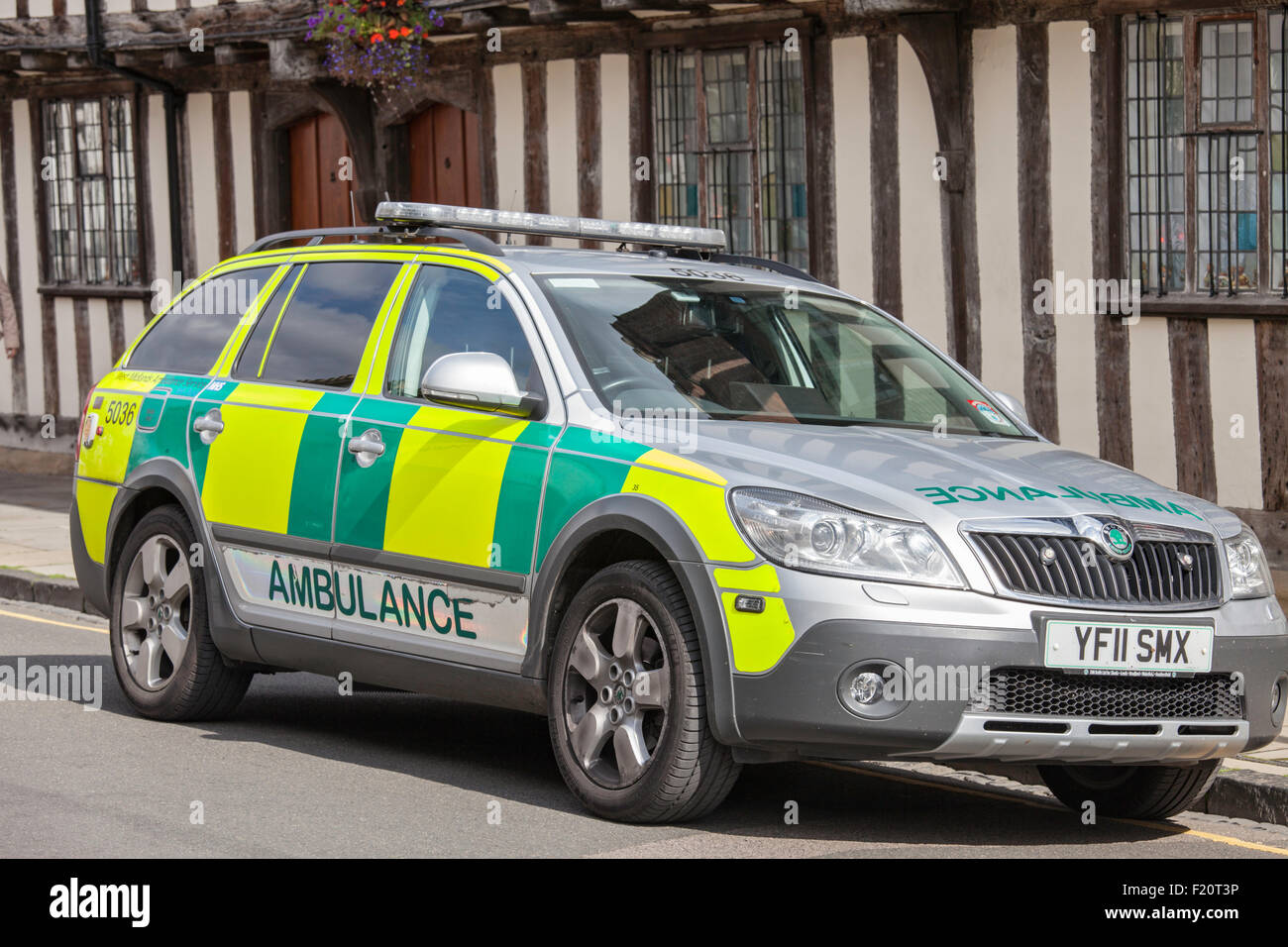 Paramedic vehicle parked outside a timber-framed building, England, UK Stock Photo