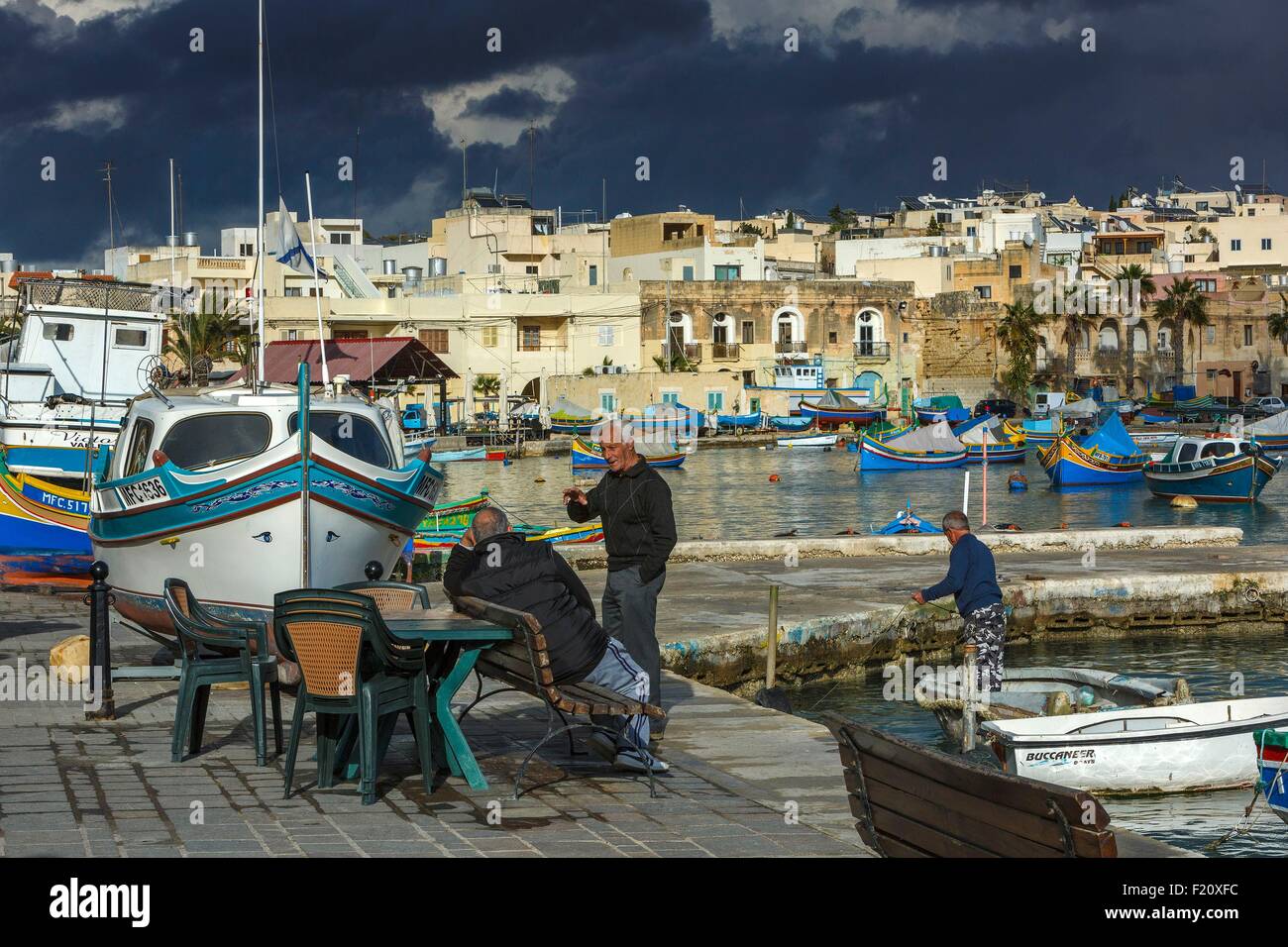 Malta, Marsaxlokk, seascape old fishermen in a Mediterranean village and traditional boats in Malta Stock Photo