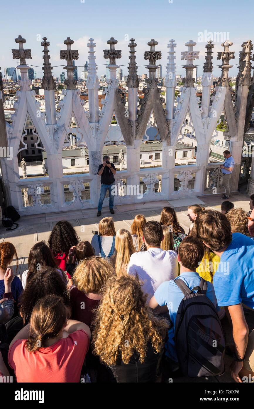 Italy, Lombardy, Milan, the arrows and statues of Duomo, souvenir photo since the terrace situated on the roof of the cathedral with a view of the district Porta Nuova with its skyscrapers Stock Photo