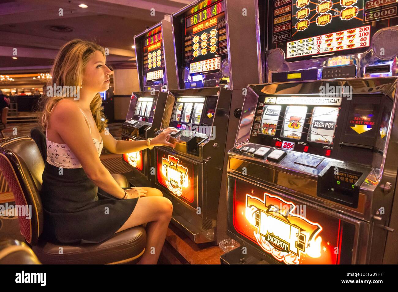 Las Vegas, NV, USA - 13th July 2013: People Playing Slot Machine Games  Inside Las Vegas Casino. Stock Photo, Picture and Royalty Free Image. Image  26254649.