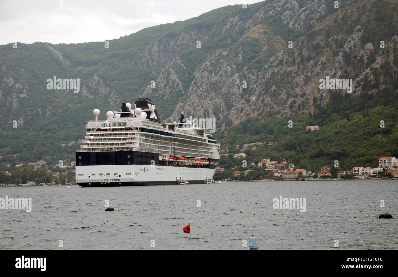 A large cruise ship in  Kotor Bay Montenegro with limestone mountains rising in the background Stock Photo