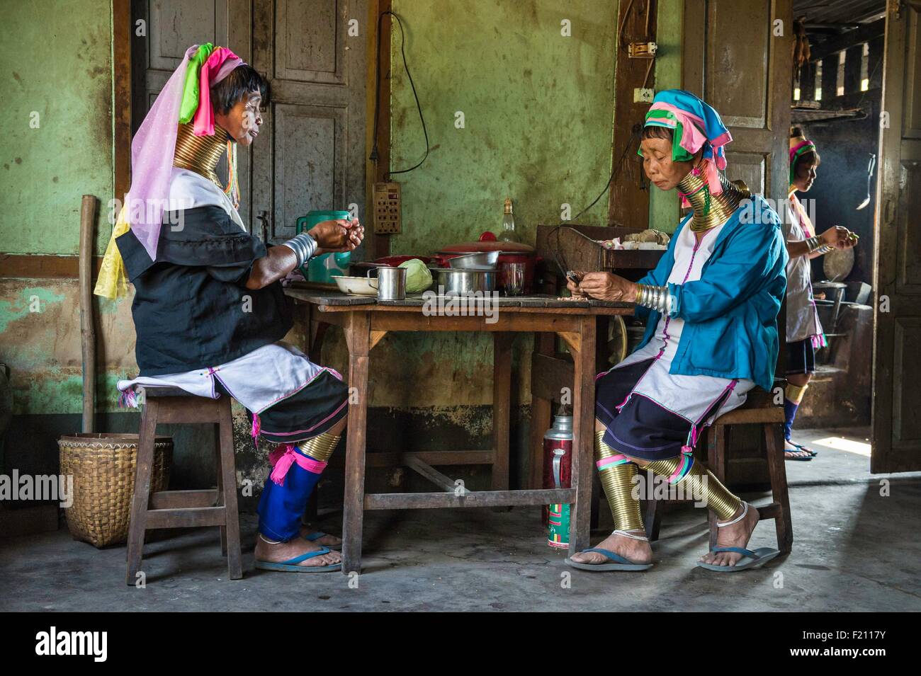 Myanmar (Burma), Kayah state, Kayan tribe (Padaung), Loikaw area, Kon Ta, women named giraffe women eating Stock Photo