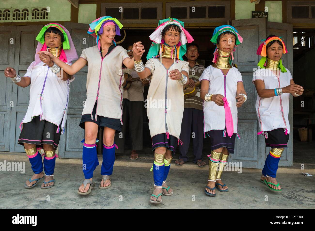 Myanmar (Burma), Kayah state, Kayan tribe (Padaung), Loikaw area, Kon Ta, tourist dancing with women named giraffe women Stock Photo