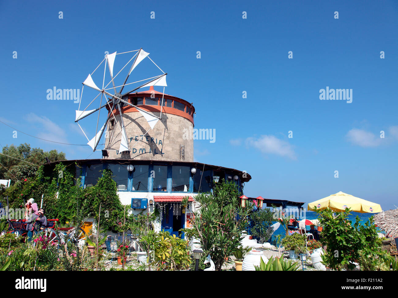 Windmill Cafeteria on the beach in Ixia Rhodes. Stock Photo