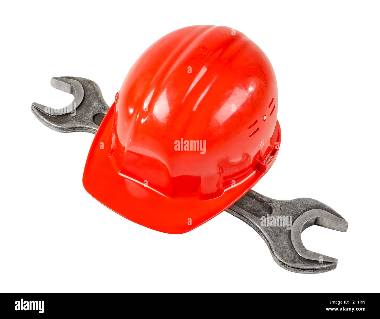 photo  red  safety cap and steel  wrench, close up on white background, full face Stock Photo