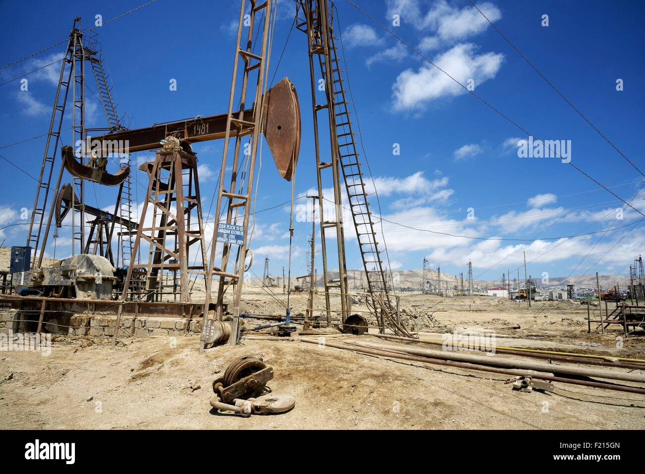 Azerbaijan, Baku, Bibi Heybat, nodding donkey oil pumps pumping oil up from the an oil field Stock Photo