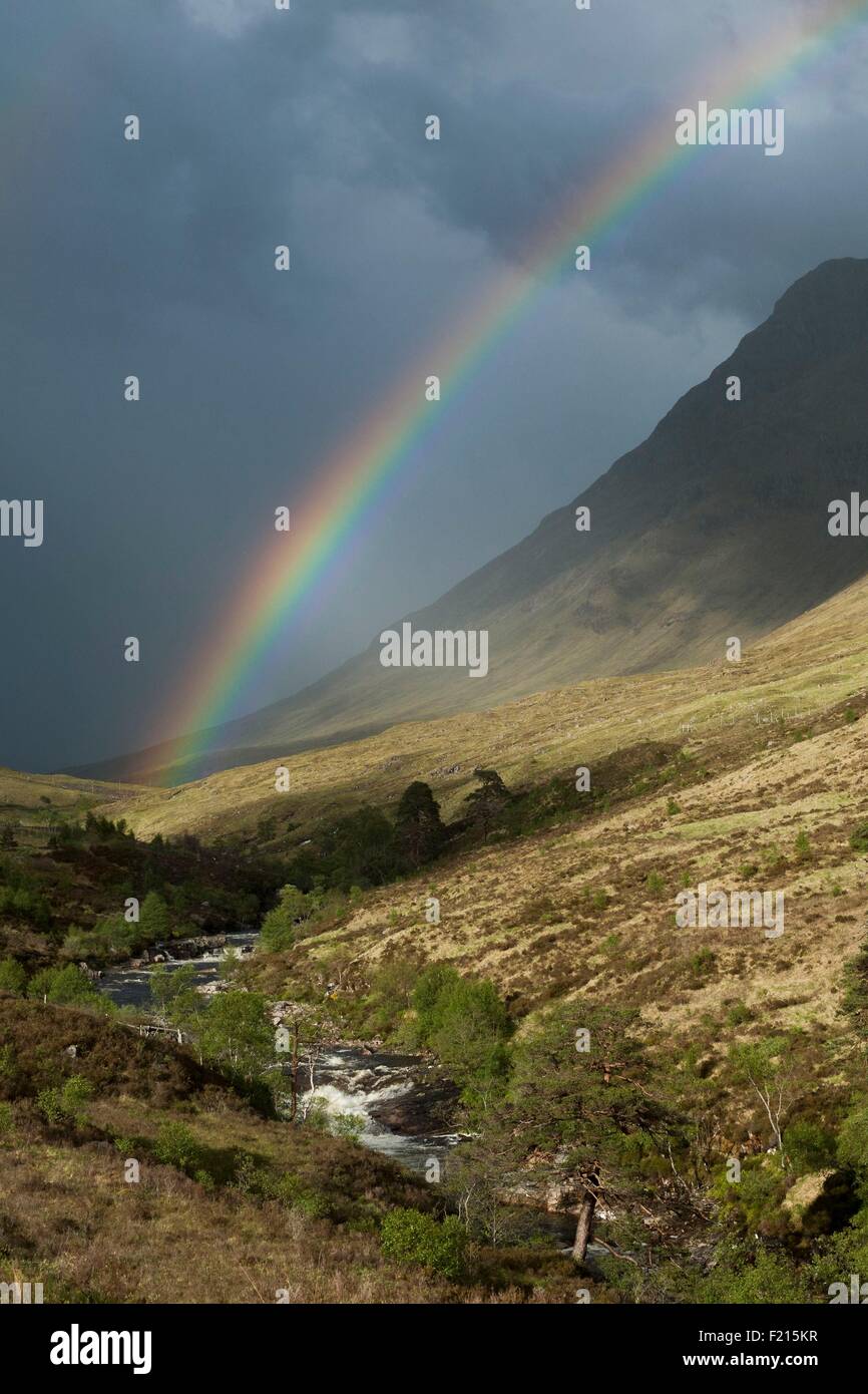 United Kingdom, Scotland, Glen Etive, Fall on River Etive and Rainbow Stock Photo