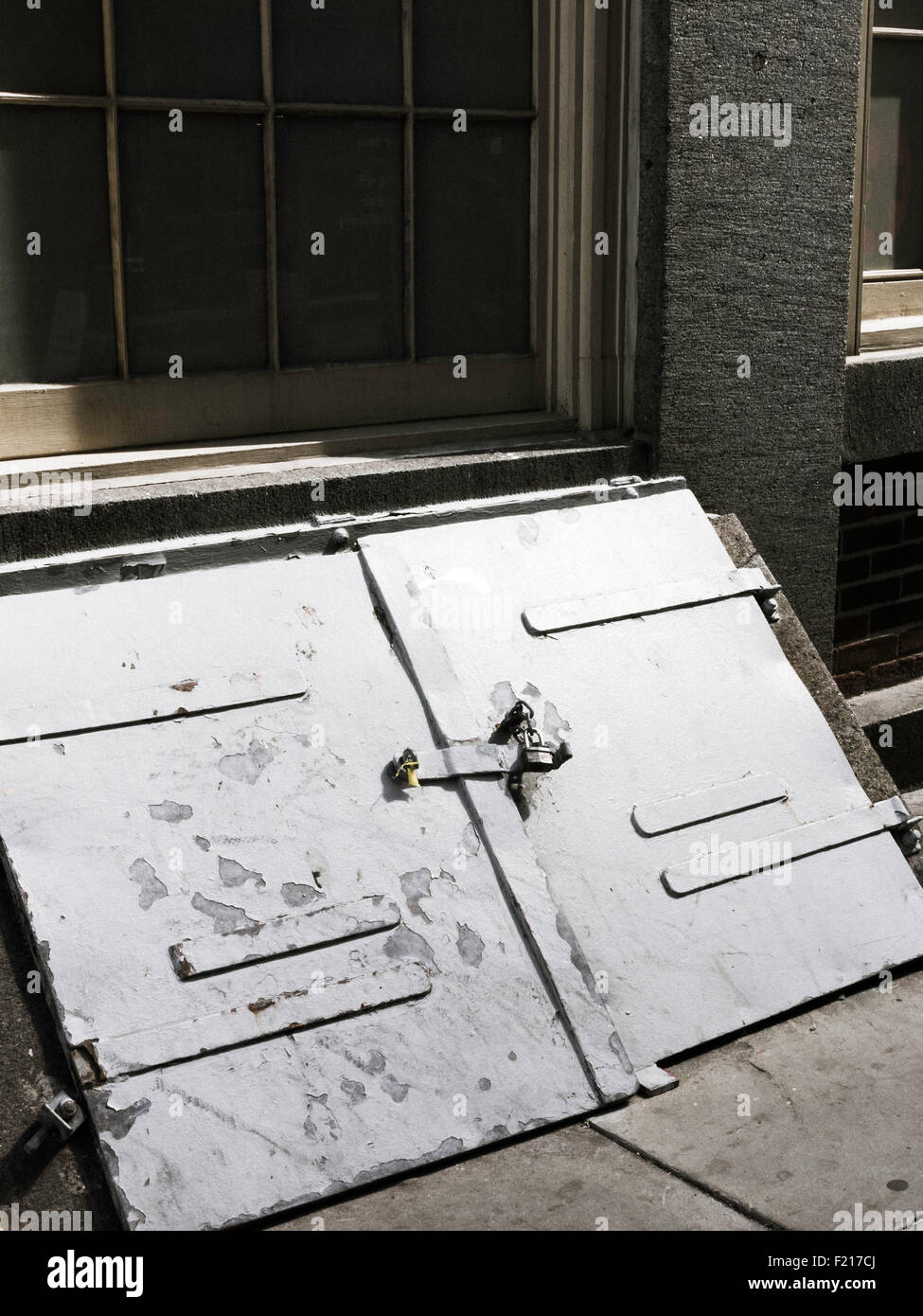 Weathered Double Cellar Doors with Hasp and Lock, NYC, USA Stock Photo