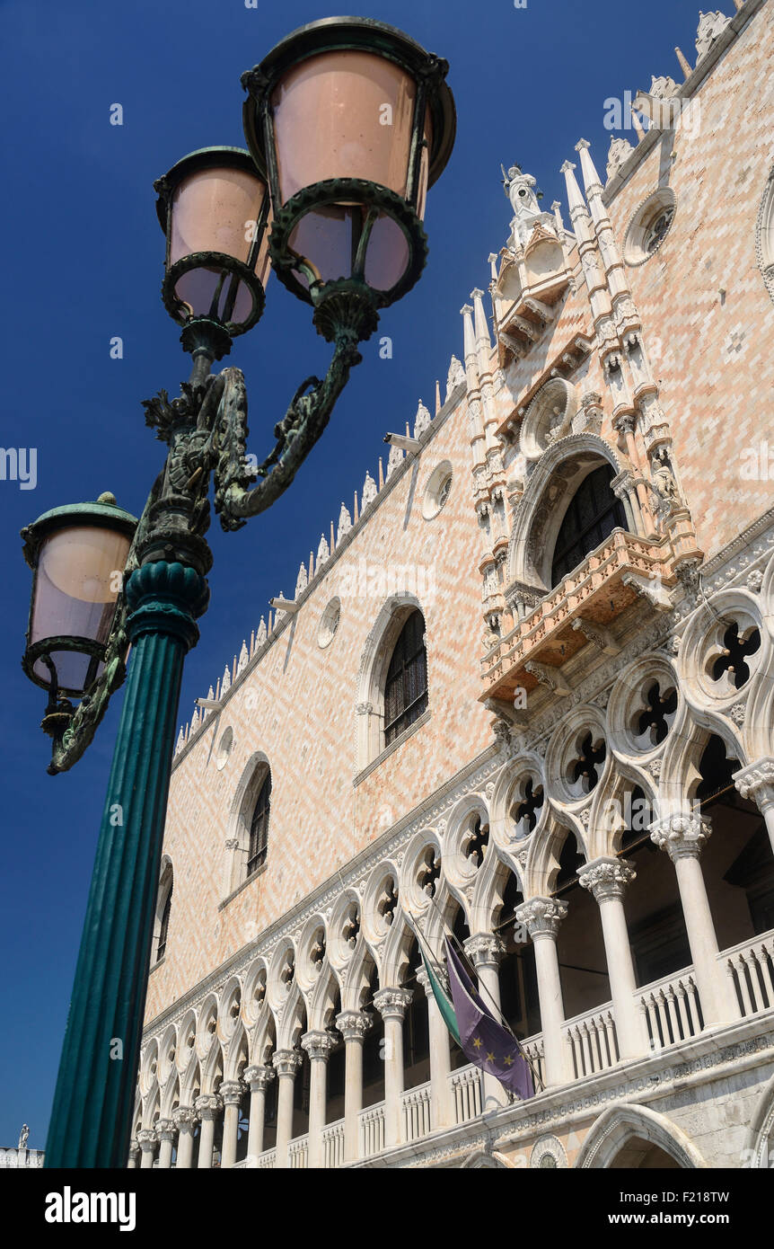 Italy, Venice, The Doge's Palace, a section of the facade with a lampstand. Stock Photo