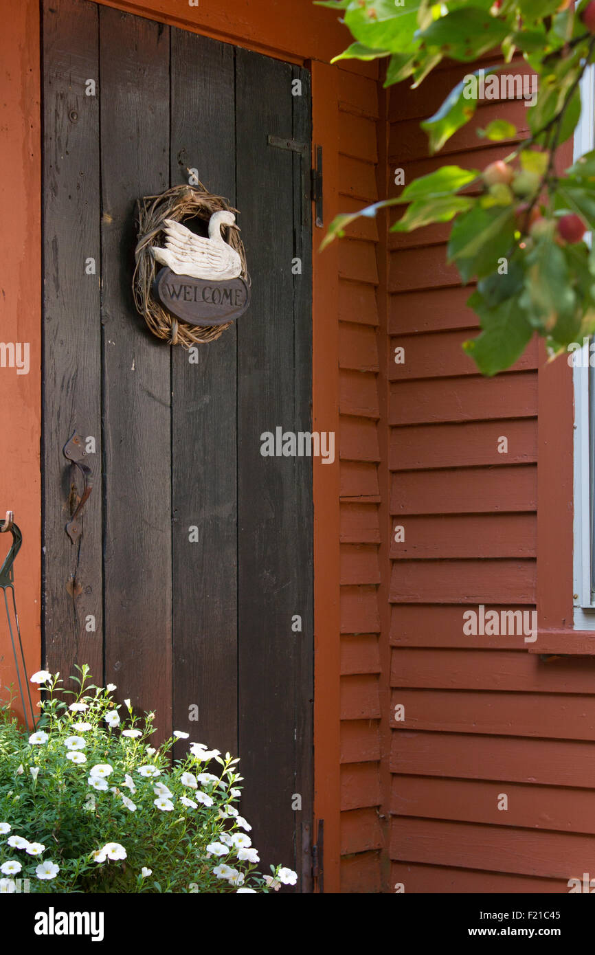 Welcome wreath on the front door of a cottage in Wiscasset, Maine.. Stock Photo