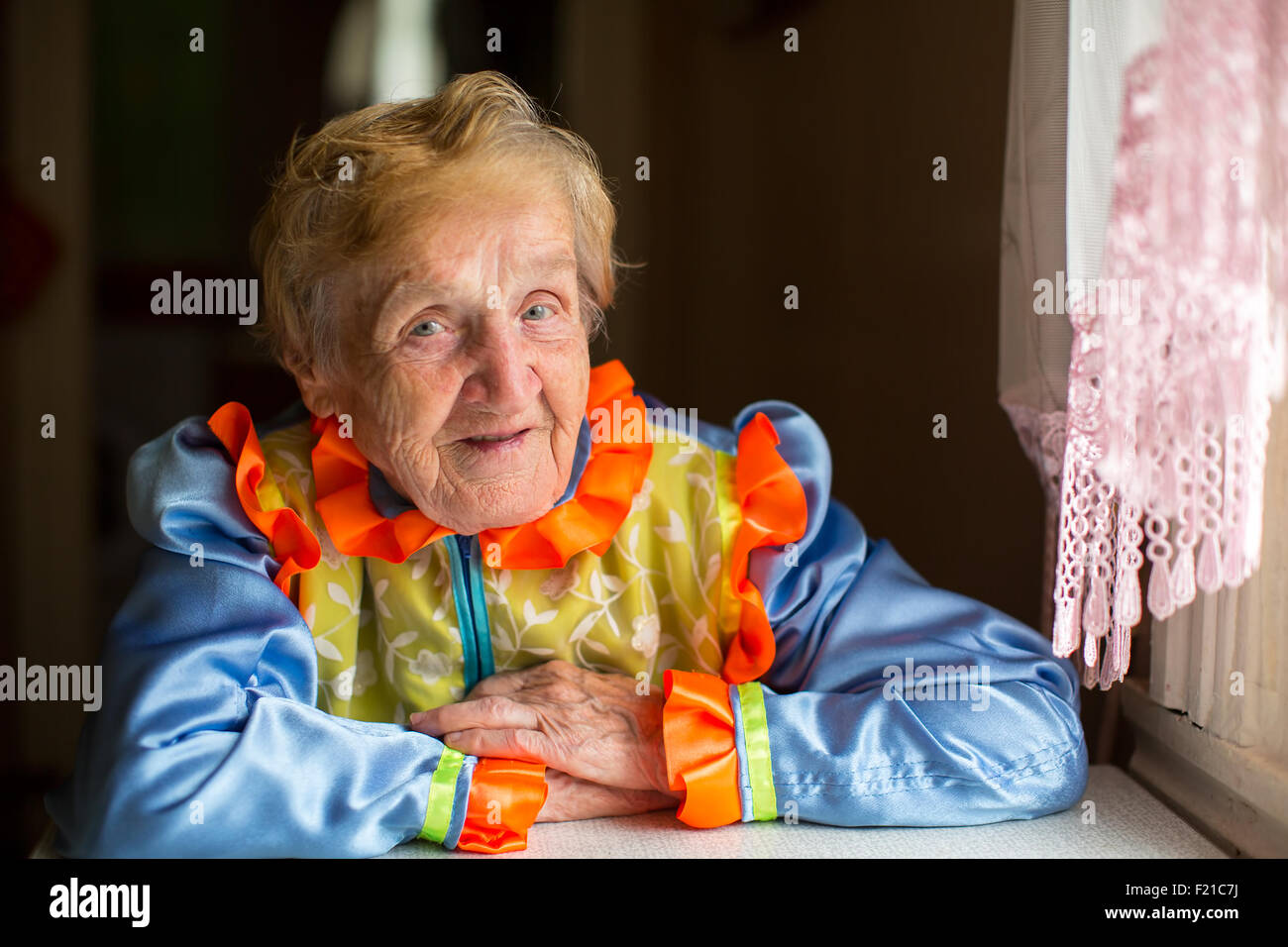 Portrait of elderly woman in the Cossack folk costume. Stock Photo