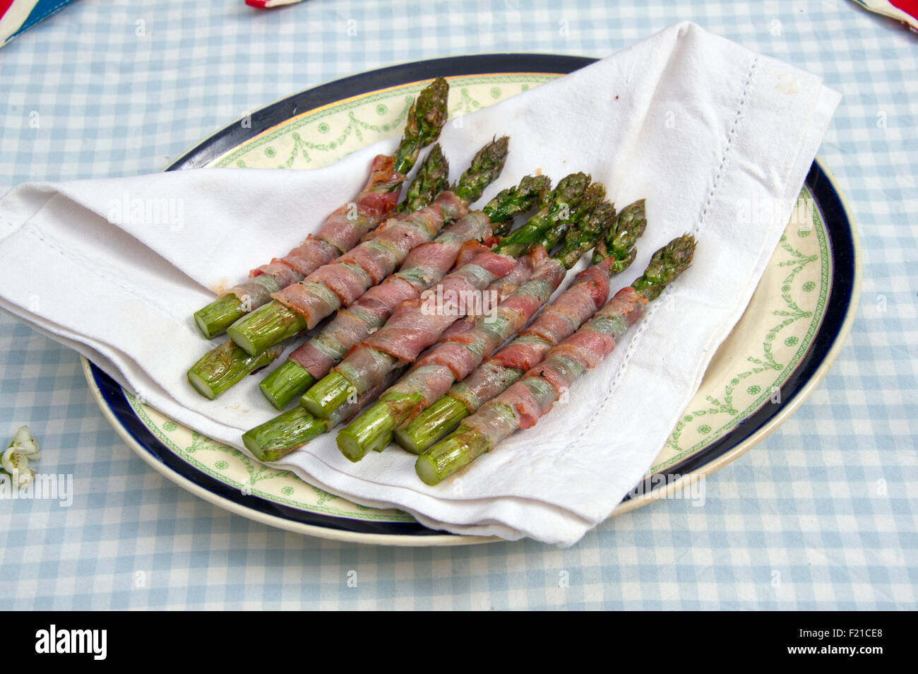 Asparagus wrapped with Parma ham. a UK food foods "small dish" "small