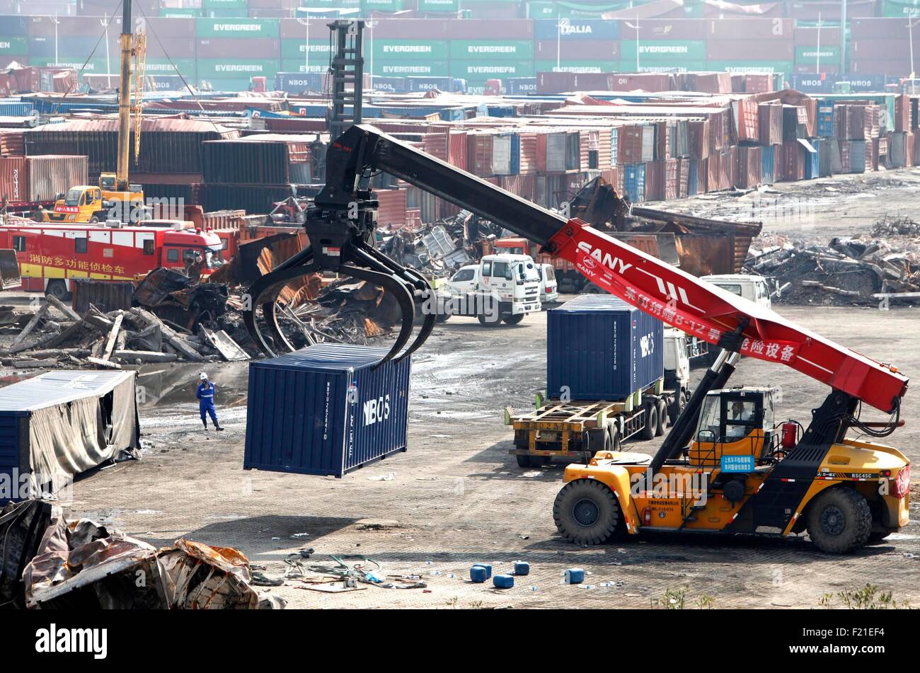 Tianjin. 10th Sep, 2015. A crane moves away a destroyed container at the core area of an warehouse explosion in Tianjin, north China, Sept. 8, 2015. The death toll from the Tianjin warehouse explosions rose to 162 on Tuesday with 11 people still unaccounted for, according to rescue authorities. Two blasts ripped through a warehouse at around 11:30 p.m. on Aug. 12 in Tianjin Port, where large amounts of toxic chemicals were stored, including around 700 tonnes of sodium cyanide. Credit:  Xinhua/Alamy Live News Stock Photo