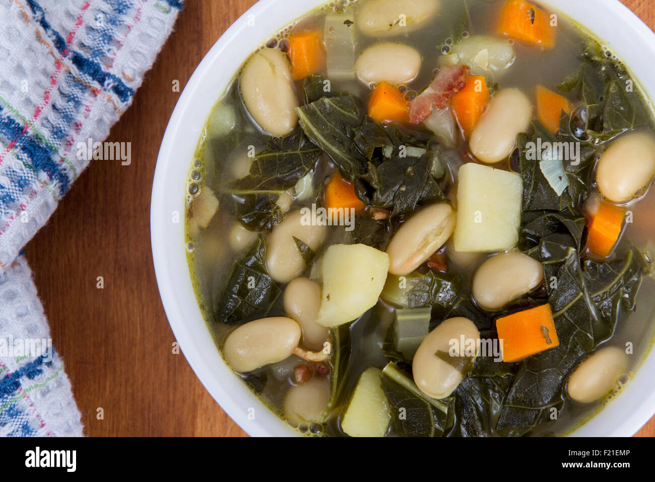 white bean bacon and kale soup bowl closeup Stock Photo Alamy